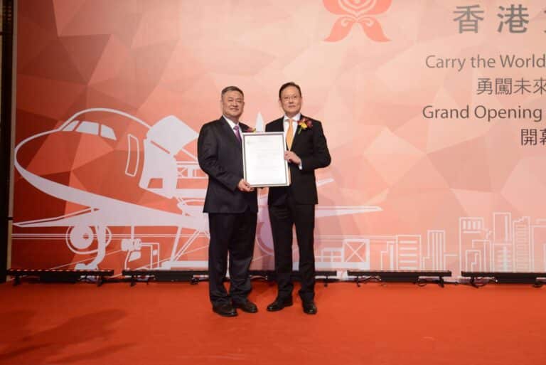 CEO of Hong Kong Air Cargo Mr. ZHONG Guosong (left hand side) just received the Air Operator's Certificate from Mr Simon Li Tin Chui, Director-General of Civil Aviation.